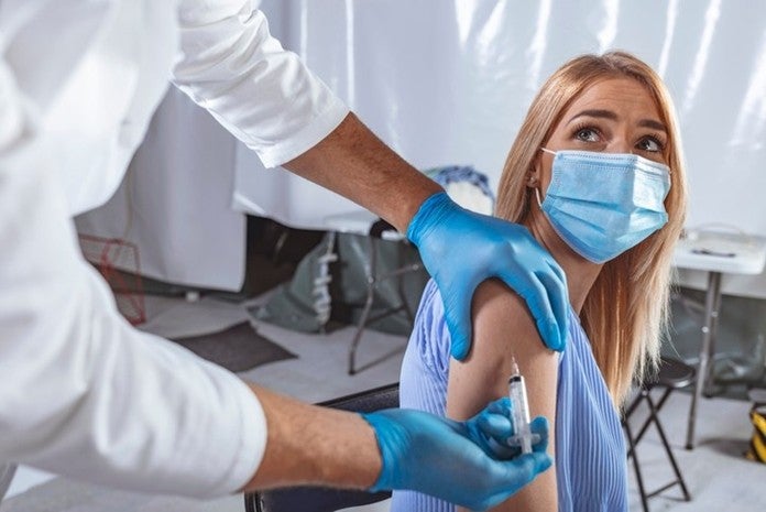A doctor gives an allergy injection to a woman in a medical setting in Surprise, AZ