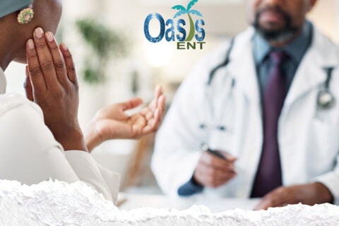 Patient discussing ear pain symptoms with ENT specialist
